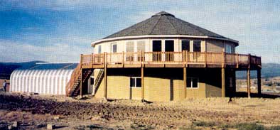The kit home is essentially circular, built from 20, 8 by 8-foot panels that attach at an 18 degree angle. The crew took a month to put the structure up.